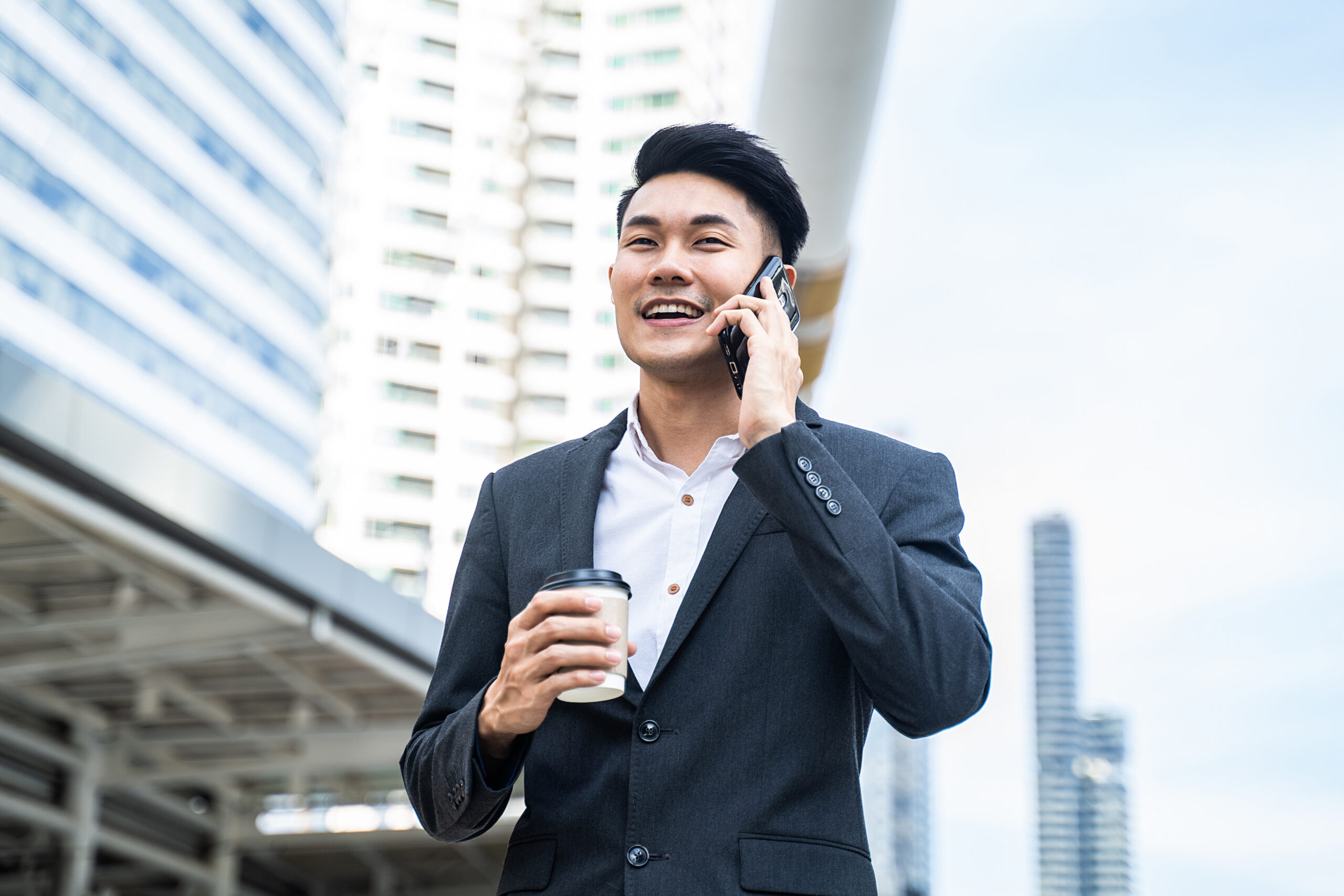 asian-young-smart-businessman-talking-in-telephone-2021-12-09-22-27-44-utc asian-young-smart-businessman-talking-in-telephone-2021-12-09-22-27-44-utc